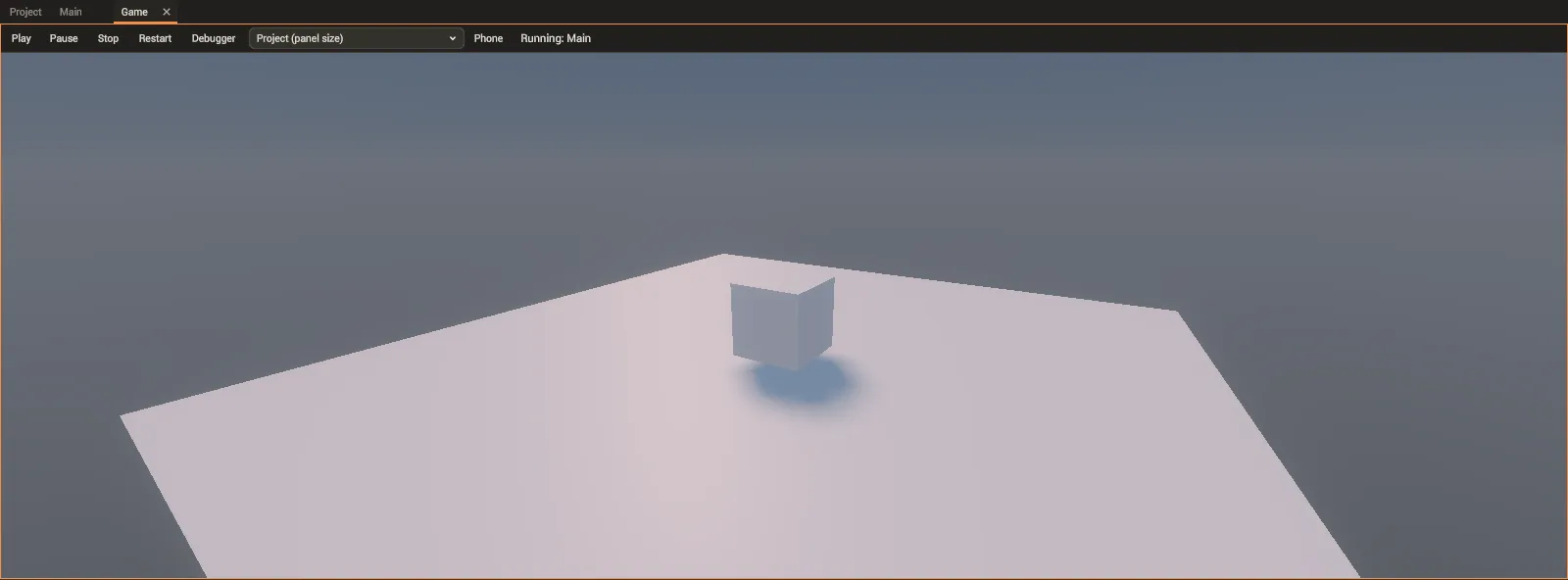 The Game tab running the scene: the box on the floor and its shadow, seen through the camera.